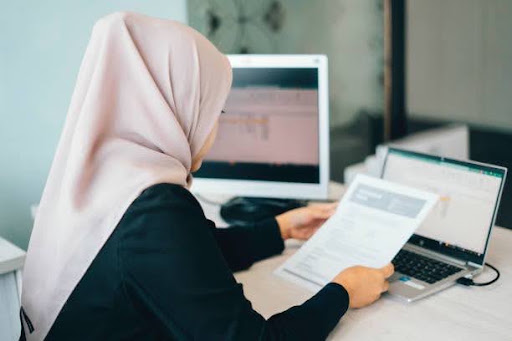 Malaysian professional reviewing tax and retirement savings during working years