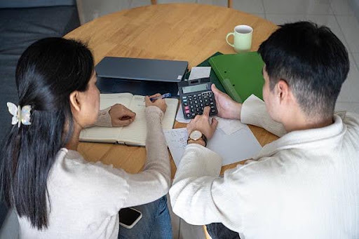 Couple calculating how tax affects the amount of income needed for retirement