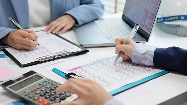 Financial documents and investment charts used for wealth management planning