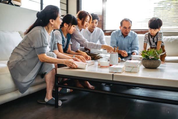 Multi-generational family reviewing a holistic financial plan together